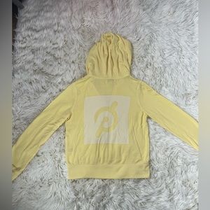 Yellow peloton zip up hoodie. Size small.